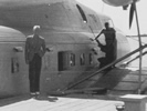 Martin 130 Clipper berthed at the Alameda base September 23, 1936. William B. Voortmeyer is on the left, standing next to the aircraft.